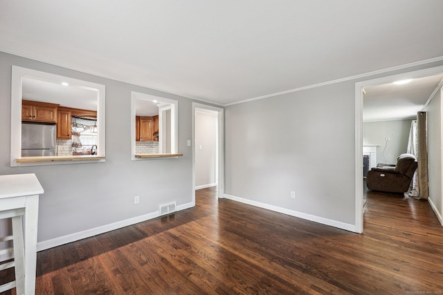 17 Burke Rd, Vernon, CT 06066 - unfurnished living room with dark wood-style floors and crown molding