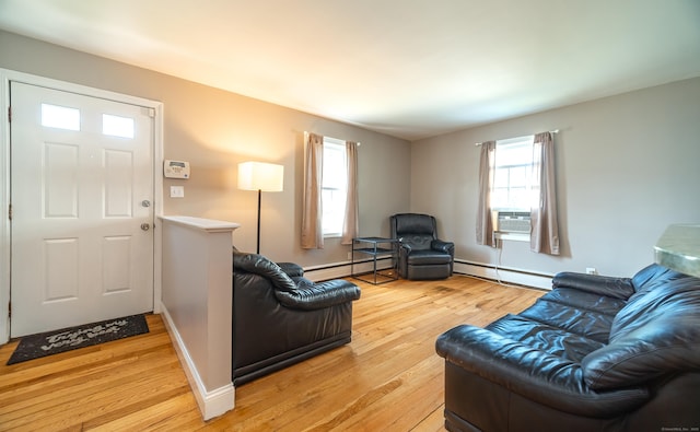 635 Ruth St, Bridgeport, CT 06606 - living room featuring baseboard heating, light wood-type flooring, and cooling unit