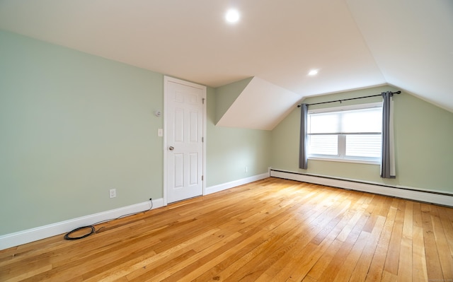 635 Ruth St, Bridgeport, CT 06606 - bonus room with a baseboard heating unit, light wood-type flooring, vaulted ceiling, and recessed lighting