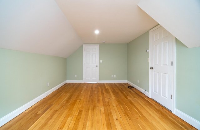 635 Ruth St, Bridgeport, CT 06606 - additional living space featuring light wood-type flooring and vaulted ceiling