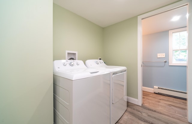 635 Ruth St, Bridgeport, CT 06606 - laundry area with a baseboard radiator, separate washer and dryer, and light wood-type flooring