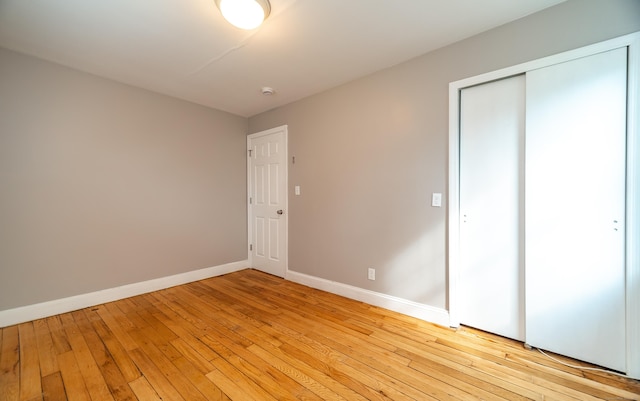 635 Ruth St, Bridgeport, CT 06606 - unfurnished bedroom featuring light wood finished floors and a closet
