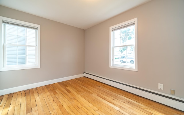 635 Ruth St, Bridgeport, CT 06606 - unfurnished room with a baseboard radiator and light wood-style flooring