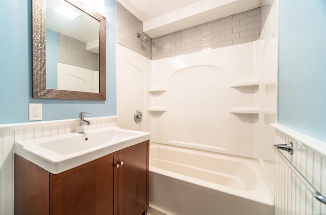 635 Ruth St, Bridgeport, CT 06606 - full bathroom featuring vanity, shower / bath combination, and wainscoting