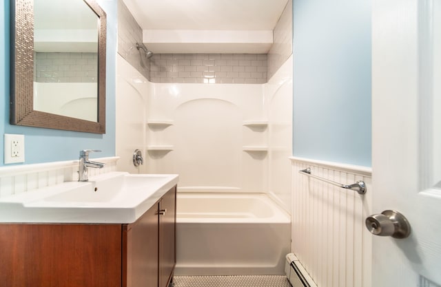 635 Ruth St, Bridgeport, CT 06606 - bathroom with vanity, bathtub / shower combination, wainscoting, and a baseboard radiator