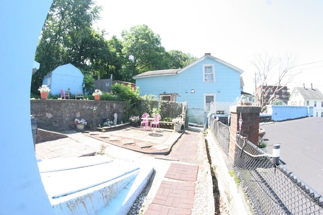 375 Baldwin St, Waterbury, CT 06706 - back of house with a fenced backyard and a patio