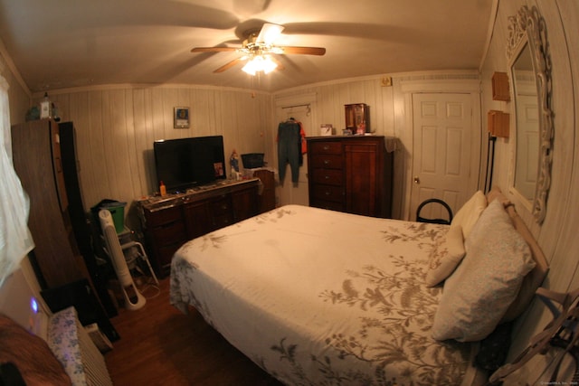 375 Baldwin St, Waterbury, CT 06706 - bedroom featuring ornamental molding, dark wood-style flooring, a ceiling fan, and wooden walls