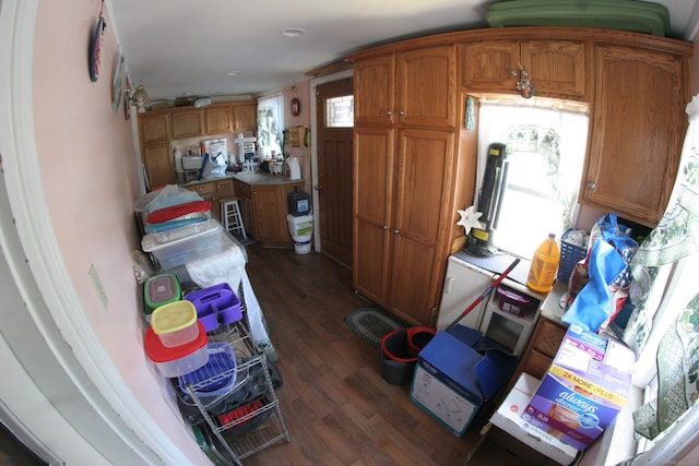 375 Baldwin St, Waterbury, CT 06706 - kitchen with brown cabinetry, dark wood-style flooring, and light countertops