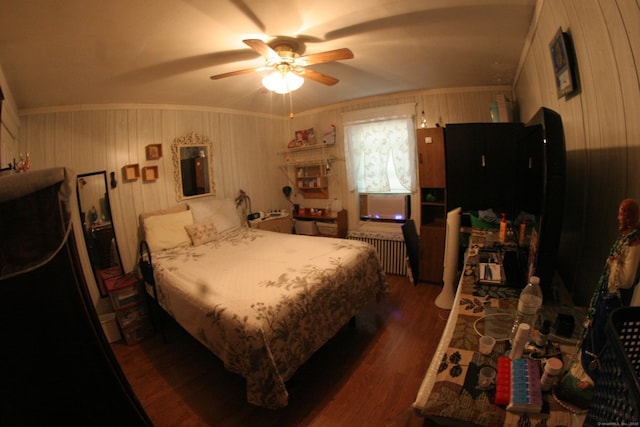 375 Baldwin St, Waterbury, CT 06706 - bedroom featuring radiator heating unit, dark wood-style floors, wood walls, and a ceiling fan