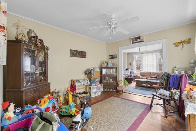 78 Church St, Hamden, CT 06514 - living area featuring wood finished floors, ceiling fan, and ornamental molding