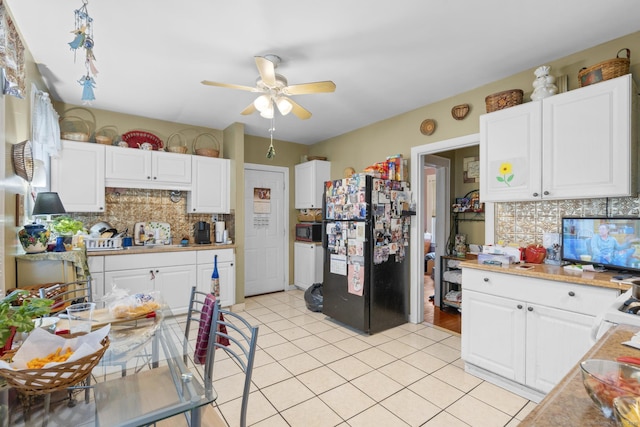 78 Church St, Hamden, CT 06514 - kitchen featuring black appliances, a ceiling fan, decorative backsplash, and light tile patterned floors