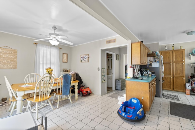 78 Church St, Hamden, CT 06514 - kitchen featuring a ceiling fan, light flooring, and brown cabinetry