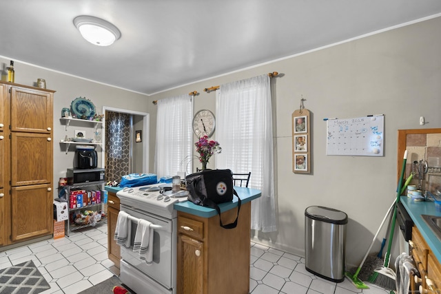 78 Church St, Hamden, CT 06514 - kitchen featuring white range, brown cabinetry, light flooring, and ornamental molding