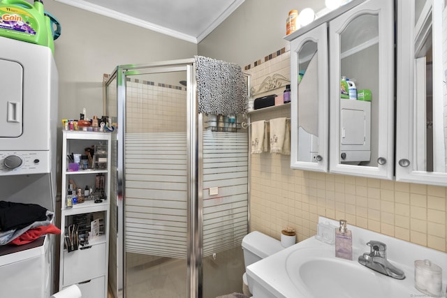 78 Church St, Hamden, CT 06514 - full bathroom with stacked washing machine and dryer, a stall shower, ornamental molding, tile walls, and vanity