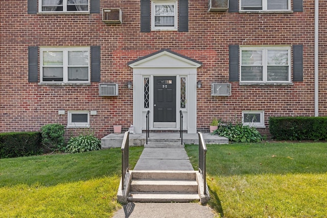 90 Strawberry Hill Ave Unit 3, Stamford, CT 06902 - view of exterior entry with brick siding and a lawn