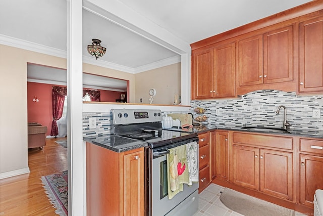 90 Strawberry Hill Ave Unit 3, Stamford, CT 06902 - kitchen featuring stainless steel electric stove, decorative backsplash, crown molding, brown cabinets, and dark stone counters