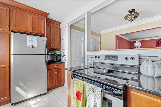 90 Strawberry Hill Ave Unit 3, Stamford, CT 06902 - kitchen with stainless steel appliances, crown molding, brown cabinets, dark stone counters, and backsplash