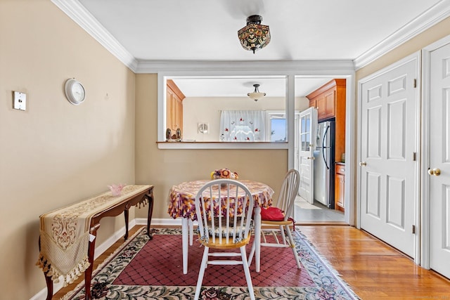 90 Strawberry Hill Ave Unit 3, Stamford, CT 06902 - dining space featuring crown molding and light wood-style floors