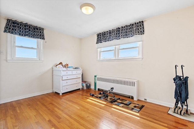 90 Strawberry Hill Ave Unit 3, Stamford, CT 06902 - miscellaneous room with radiator, healthy amount of natural light, and hardwood / wood-style flooring