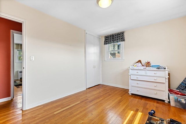 90 Strawberry Hill Ave Unit 3, Stamford, CT 06902 - bedroom featuring light wood-type flooring and a closet