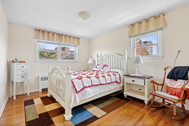 90 Strawberry Hill Ave Unit 3, Stamford, CT 06902 - bedroom with radiator and wood finished floors