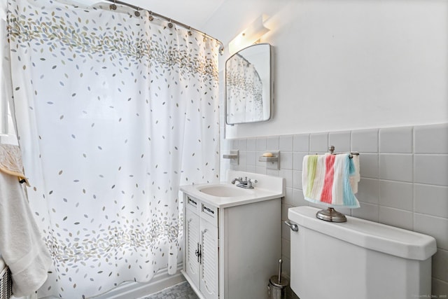 90 Strawberry Hill Ave Unit 3, Stamford, CT 06902 - bathroom featuring vanity, tile walls, and wainscoting
