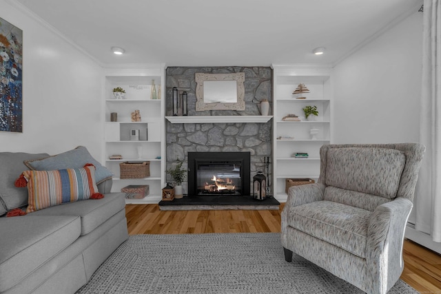 449 Mohegan Avenue Parkway, Waterford, CT 06375 - living area with a stone fireplace, crown molding, wood finished floors, and built in features