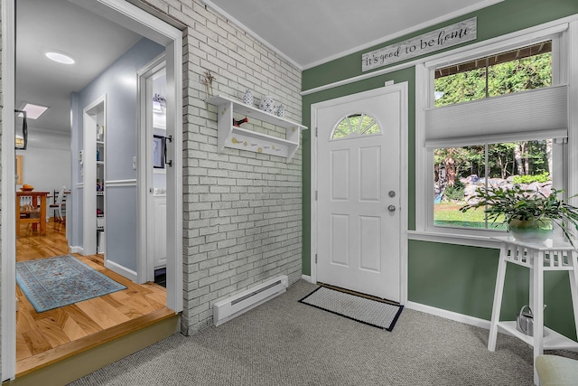 449 Mohegan Avenue Parkway, Waterford, CT 06375 - entrance foyer with baseboard heating, brick wall, and ornamental molding