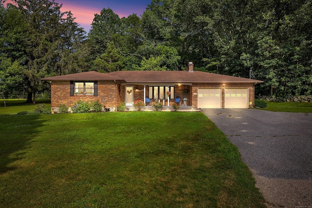 449 Mohegan Avenue Parkway, Waterford, CT 06375 - ranch-style house with brick siding, driveway, and a yard