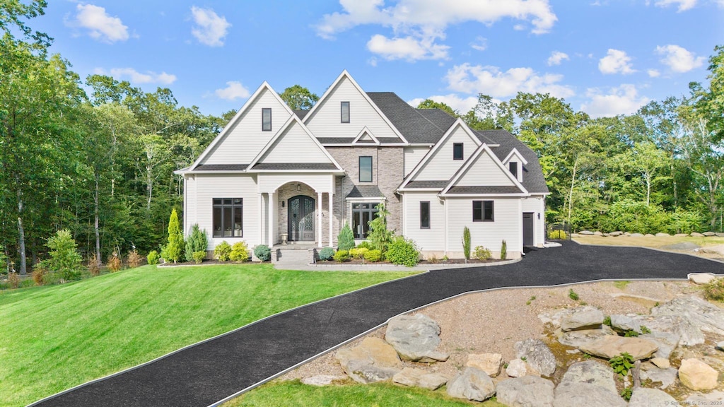 46 Signal Ridge Rd, Glastonbury, CT 06073 - traditional-style home with a front yard, driveway, and roof with shingles