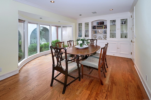 3853 Congress St, Fairfield, CT 06824 - dining room featuring light wood-type flooring, plenty of natural light, crown molding, and recessed lighting