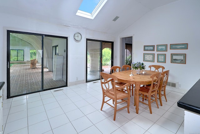 3853 Congress St, Fairfield, CT 06824 - dining area featuring lofted ceiling, a skylight, and light tile patterned floors