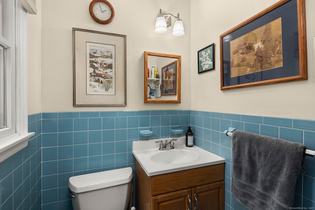 17 Valley Stream Dr, Danbury, CT 06811 - half bathroom with vanity, a wainscoted wall, and tile walls