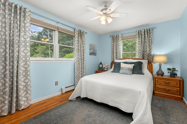 17 Valley Stream Dr, Danbury, CT 06811 - bedroom with baseboard heating, wood finished floors, and ceiling fan