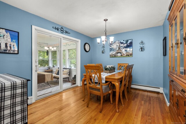 17 Valley Stream Dr, Danbury, CT 06811 - dining room with a baseboard heating unit, a chandelier, and wood finished floors