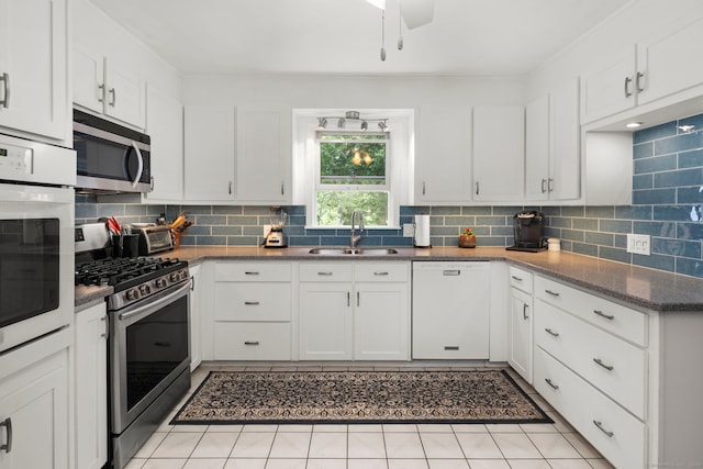 17 Valley Stream Dr, Danbury, CT 06811 - kitchen with stainless steel appliances, tasteful backsplash, and white cabinets