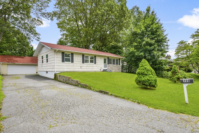 198 Macon Dr, Bridgeport, CT 06606 - single story home featuring a front lawn and a detached garage