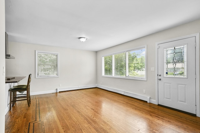 198 Macon Dr, Bridgeport, CT 06606 - foyer entrance featuring plenty of natural light and wood finished floors