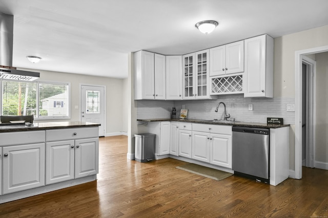 198 Macon Dr, Bridgeport, CT 06606 - kitchen with stainless steel dishwasher, dark wood-style floors, glass insert cabinets, and white cabinetry