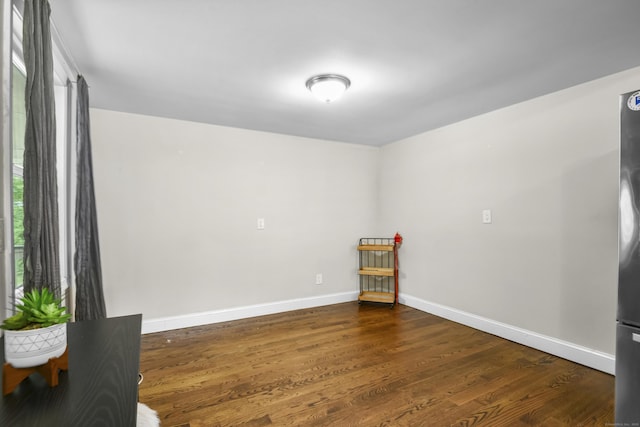 198 Macon Dr, Bridgeport, CT 06606 - empty room featuring dark wood finished floors and baseboards