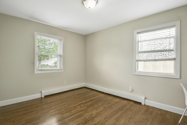198 Macon Dr, Bridgeport, CT 06606 - spare room featuring dark wood-type flooring and a baseboard radiator
