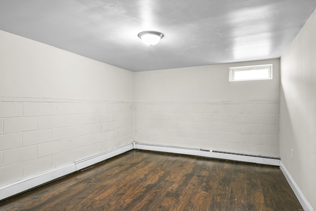 198 Macon Dr, Bridgeport, CT 06606 - empty room with wood finished floors and a baseboard heating unit