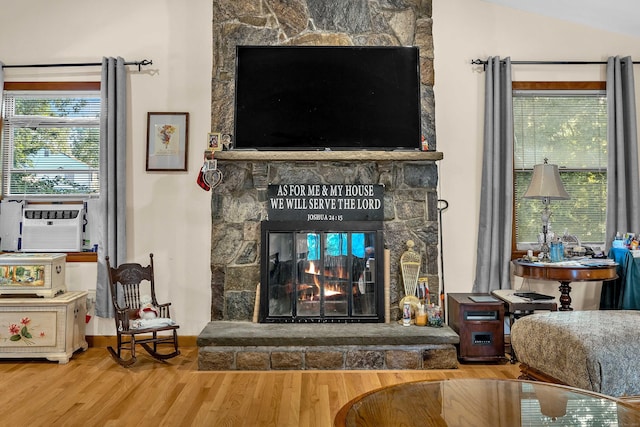 41 Fog Plain Rd, Waterford, CT 06385 - detailed view of wood finished floors, a fireplace, and cooling unit