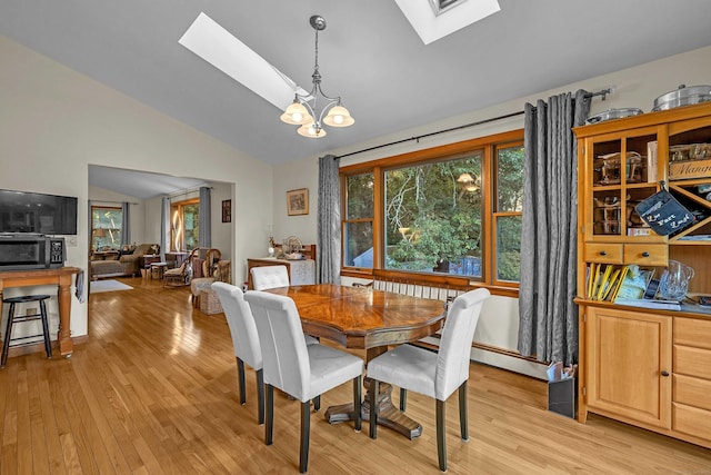 41 Fog Plain Rd, Waterford, CT 06385 - dining space featuring a skylight, lofted ceiling, light wood finished floors, and healthy amount of natural light