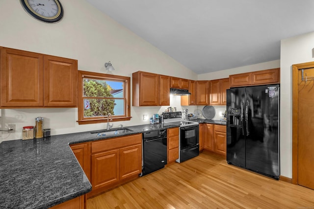 41 Fog Plain Rd, Waterford, CT 06385 - kitchen featuring black appliances, under cabinet range hood, light wood finished floors, brown cabinets, and high vaulted ceiling
