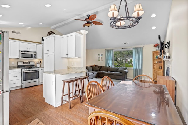 76 Valley View Rd, Norwalk, CT 06851 - dining area with light wood finished floors, a chandelier, a ceiling fan, and recessed lighting