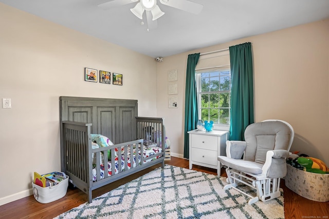 76 Valley View Rd, Norwalk, CT 06851 - bedroom with a nursery area, wood finished floors, and ceiling fan