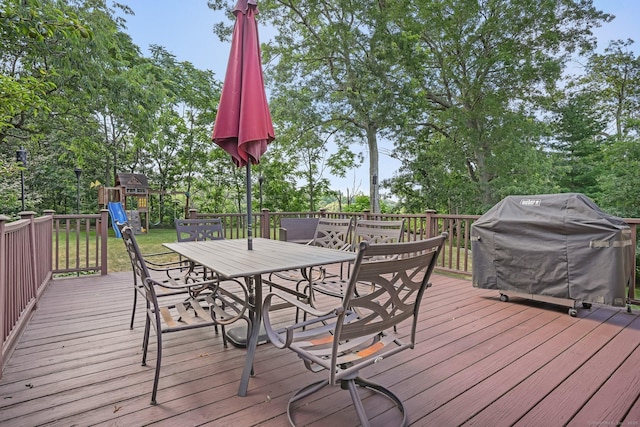 76 Valley View Rd, Norwalk, CT 06851 - deck featuring outdoor dining area, a grill, a playground, and view of wooded area