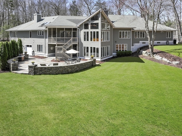 80 Norton Rd, Easton, CT 06612 - rear view of house with a chimney, a sunroom, a patio area, and a lawn