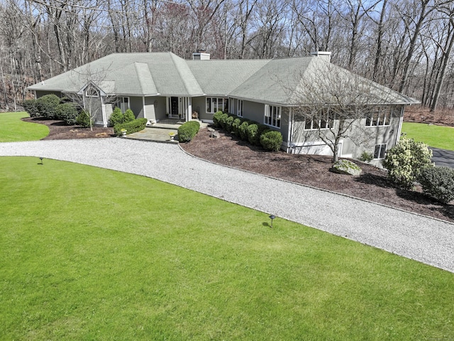 80 Norton Rd, Easton, CT 06612 - single story home with a chimney, gravel driveway, and a front yard